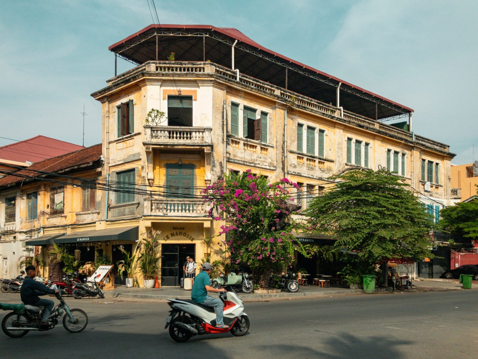 The energetic atmosphere of Hanoi's Old Quarter at night, showcasing the lively street food culture and beautiful colonial architecture that defines the historic 36 Streets